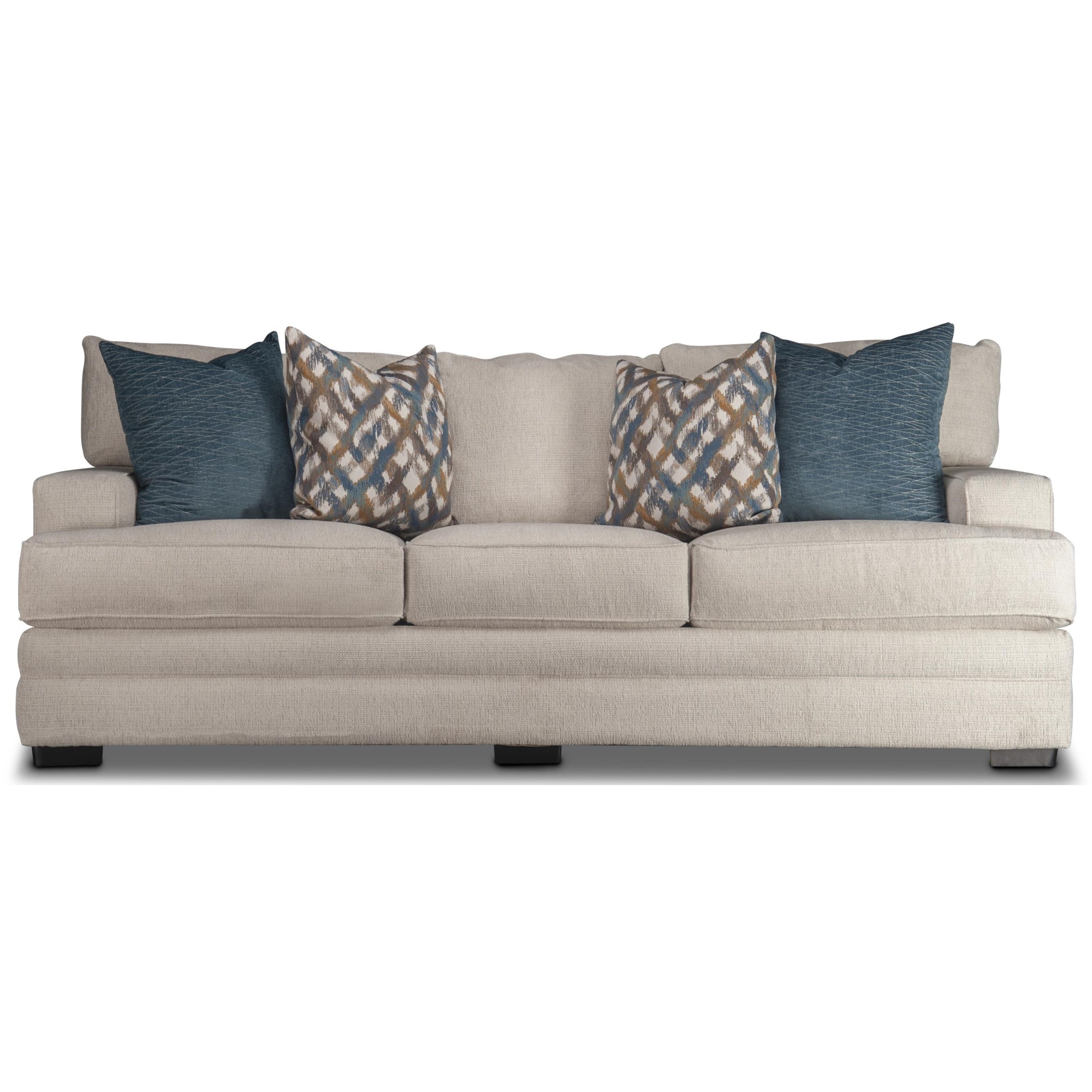 WHite and blue pillows accent a white linen couch placed in a
