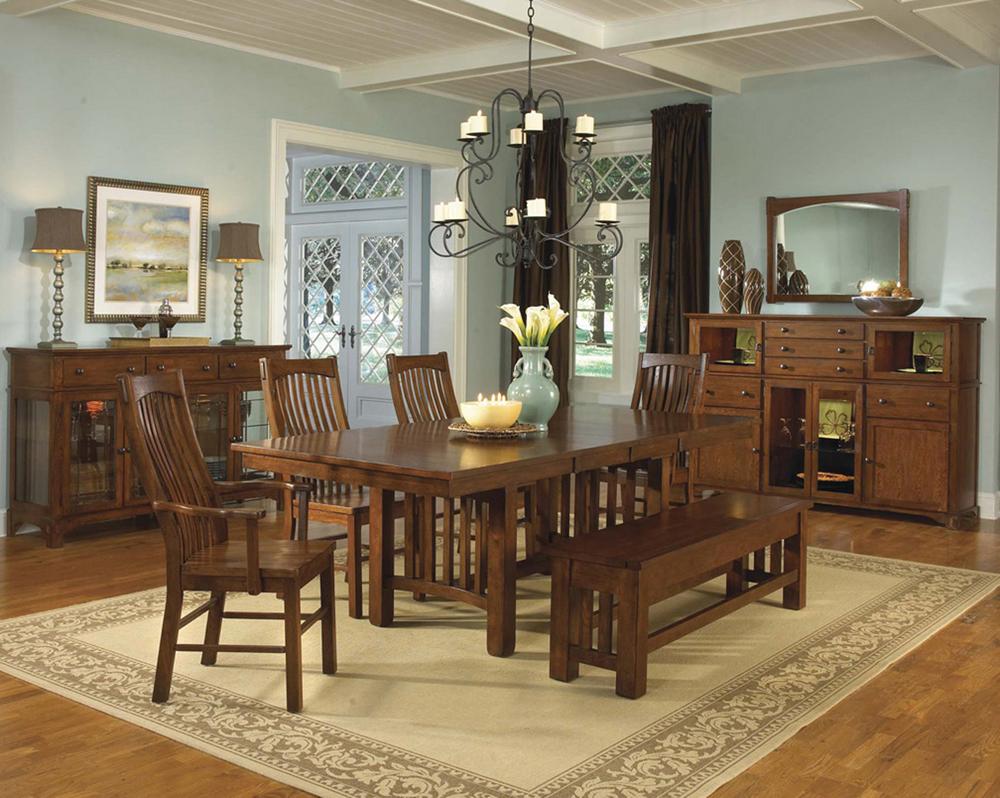 Extendable dining table with self storing leaves top