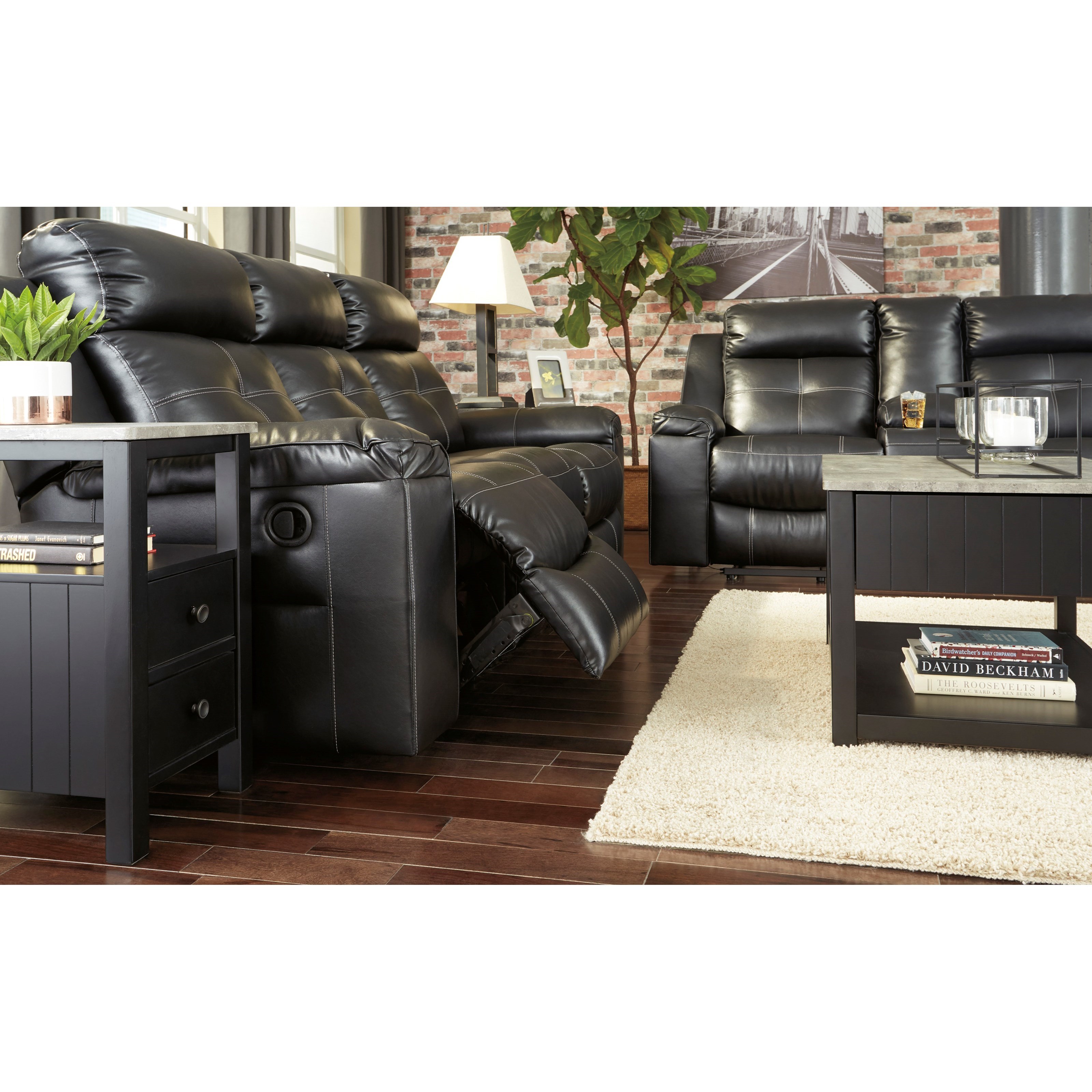 Kempten black reclining store sofa by ashley